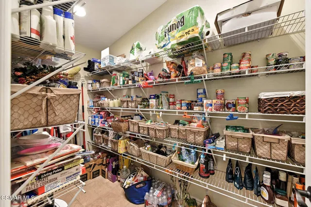 a bedroom with a bed and a television