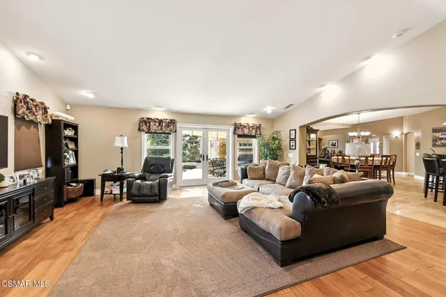 a spacious bathroom with a granite countertop tub sink and mirror