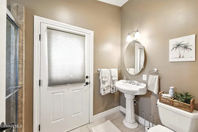 a bathroom with a shower and a toilet