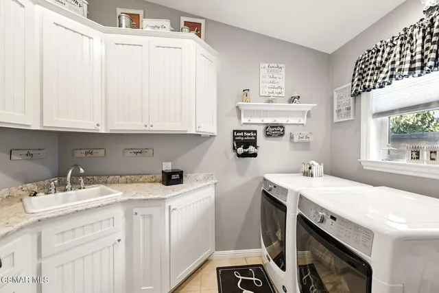 a view of a patio with table and chairs with wooden floor and fence