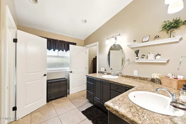 a view of a patio with table and chairs and potted plants