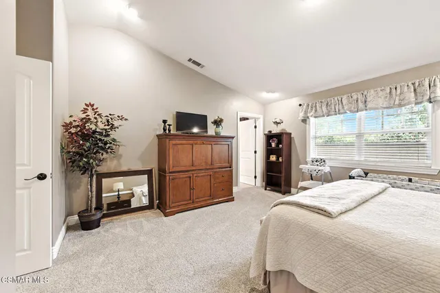 a view of a balcony with floor to ceiling windows with wooden floor