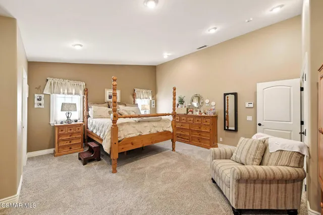a view of a terrace with a garden and trees
