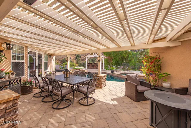an aerial view of a house with garden space and street view