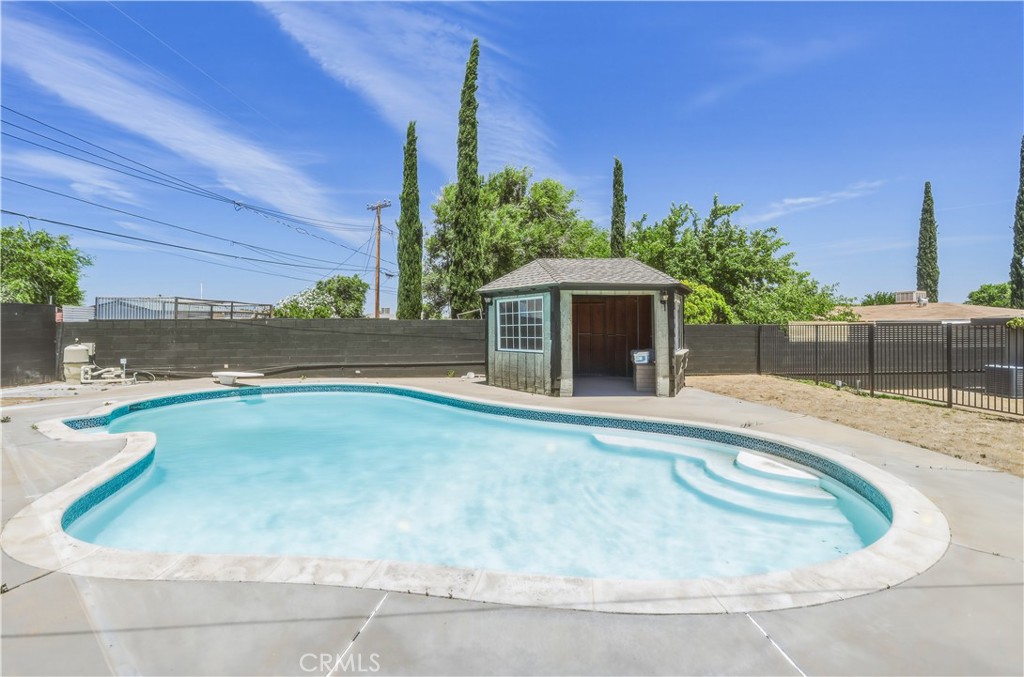 38859 Mesquite Road Palmdale, CA 93551 - Photo 33 of 36 a view of a swimming pool with a patio