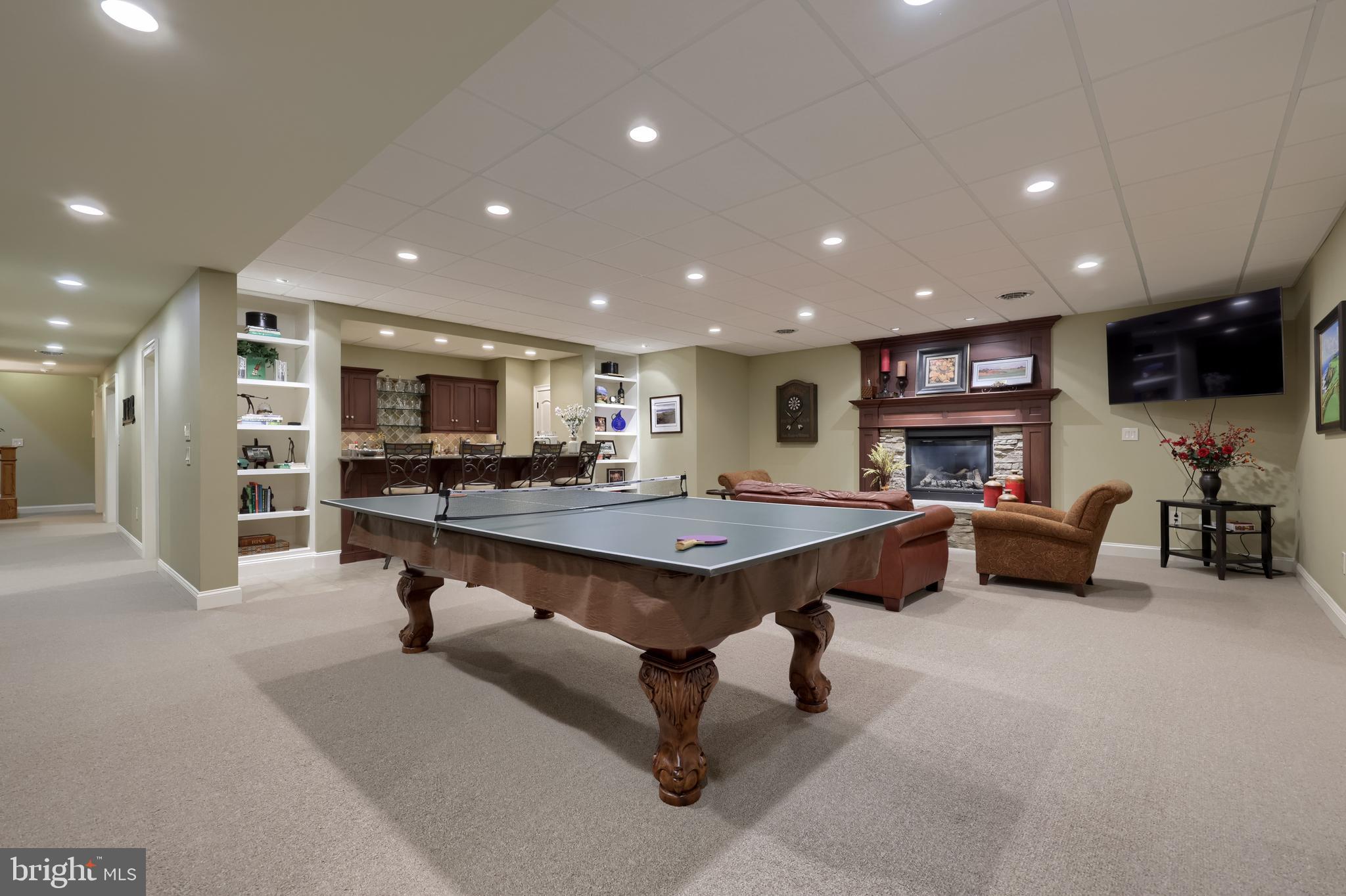 905 Greenside Drive Lititz, PA 17543 - Photo 90 of 127 a living room with furniture a pool table and a flat screen tv