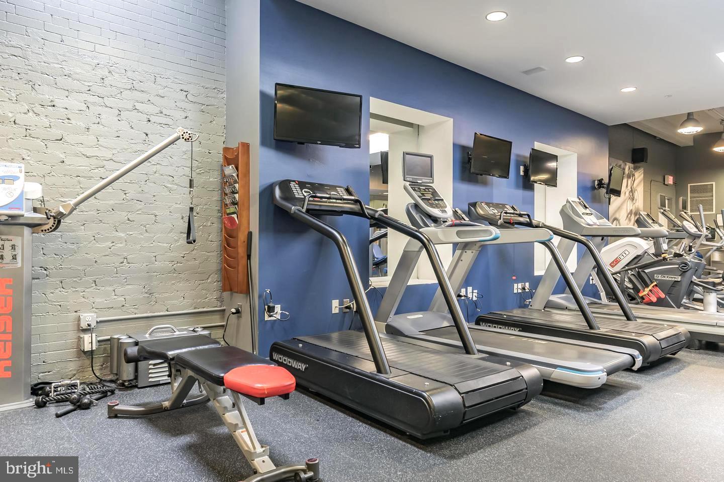 1600-18 Arch Street, Unit 1013 Philadelphia, PA 19103 - Photo 29 of 31 a room with gym equipment and flat screen tv