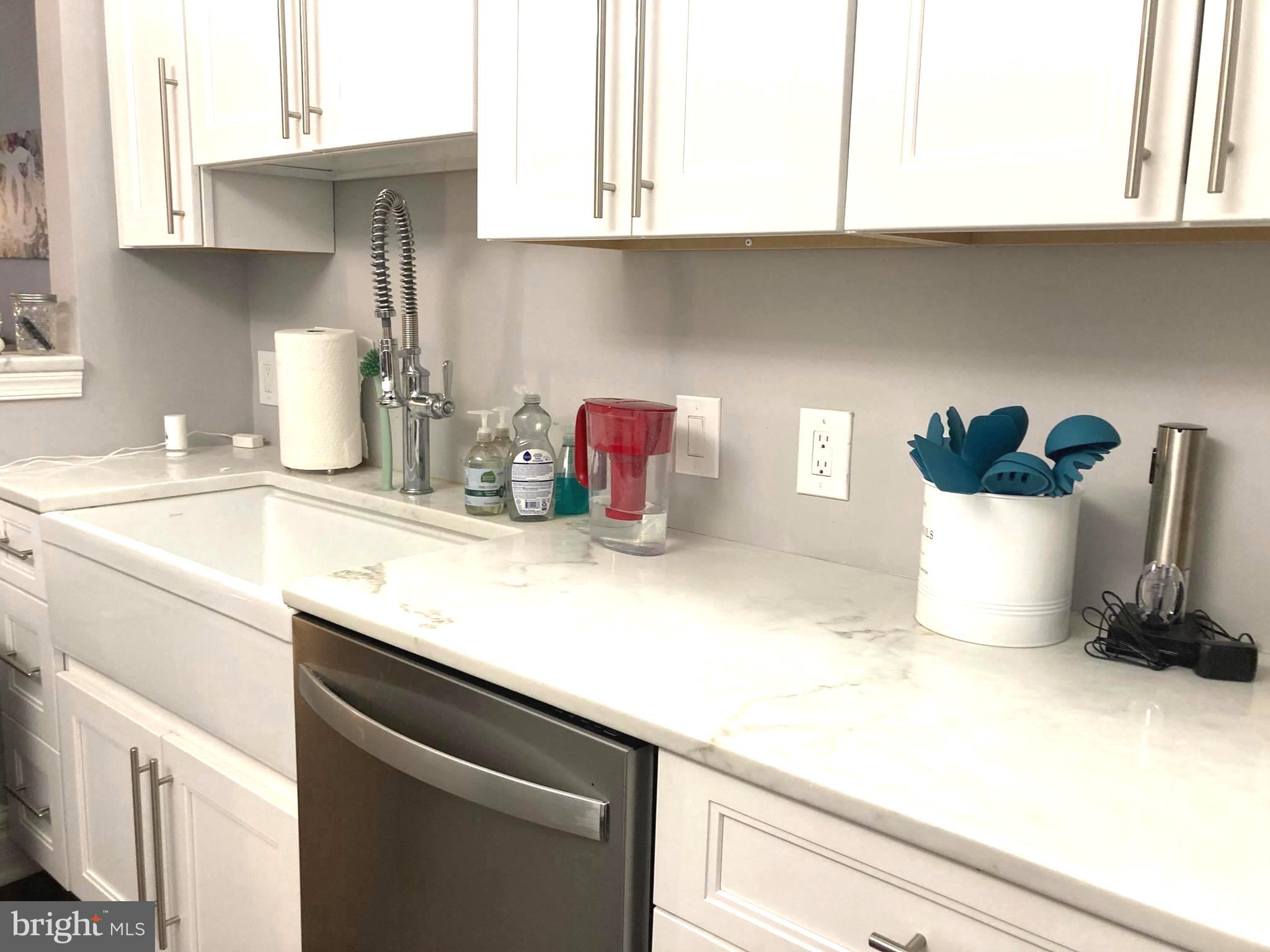 1600-18 Arch Street, Unit 1013 Philadelphia, PA 19103 - Photo 3 of 31 a kitchen with a sink cabinets and appliances