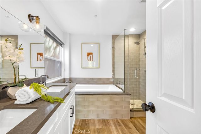 a bathroom with a granite countertop sink a toilet and a shower curtain