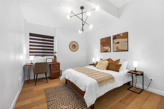 a bedroom with a bed and a chair