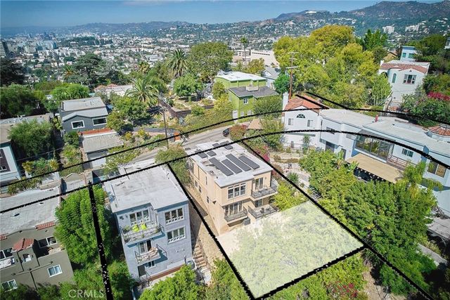 an aerial view of a house with a lake view