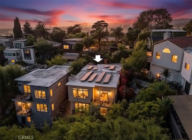 a aerial view of a residential apartment building with a yard