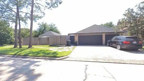 a house view with a backyard space
