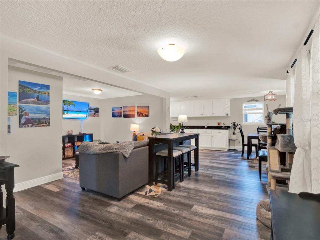 2721 Evergreen Drive Edgewater, FL 32141 - Photo 11 of 29 a living room with furniture and kitchen view
