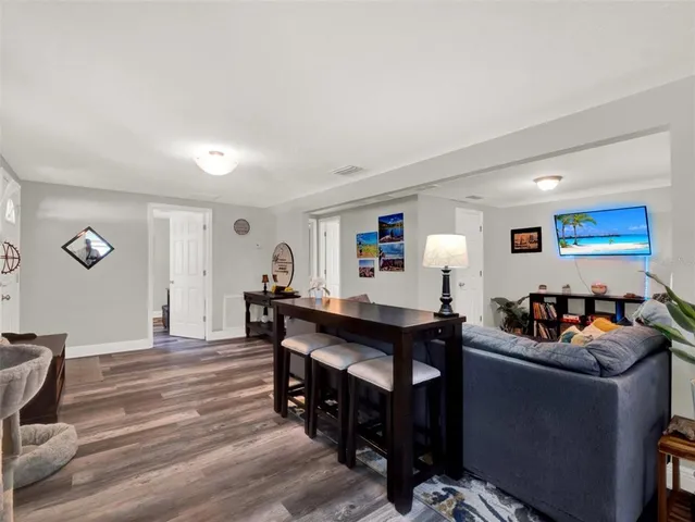 a bedroom with furniture and a potted plant