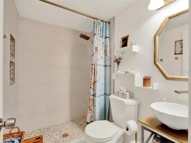 a bedroom with furniture and a wooden floor