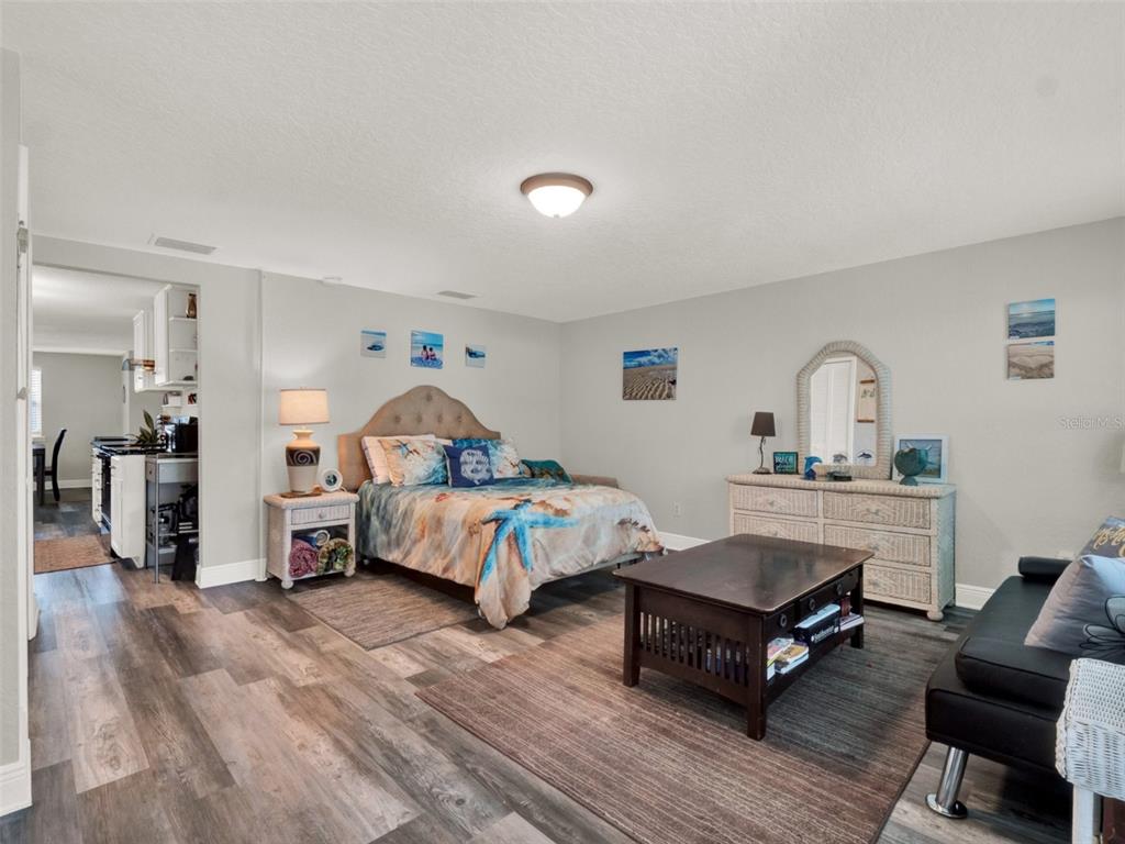 2721 Evergreen Drive Edgewater, FL 32141 - Photo 22 of 29 a bedroom with furniture and a wooden floor