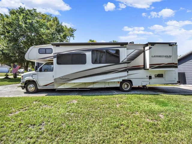 a large kitchen with stainless steel appliances granite countertop lots of counter top space