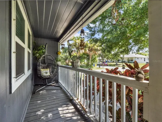 a view of a balcony with chairs