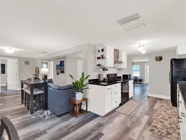 a kitchen with a table and chairs in it