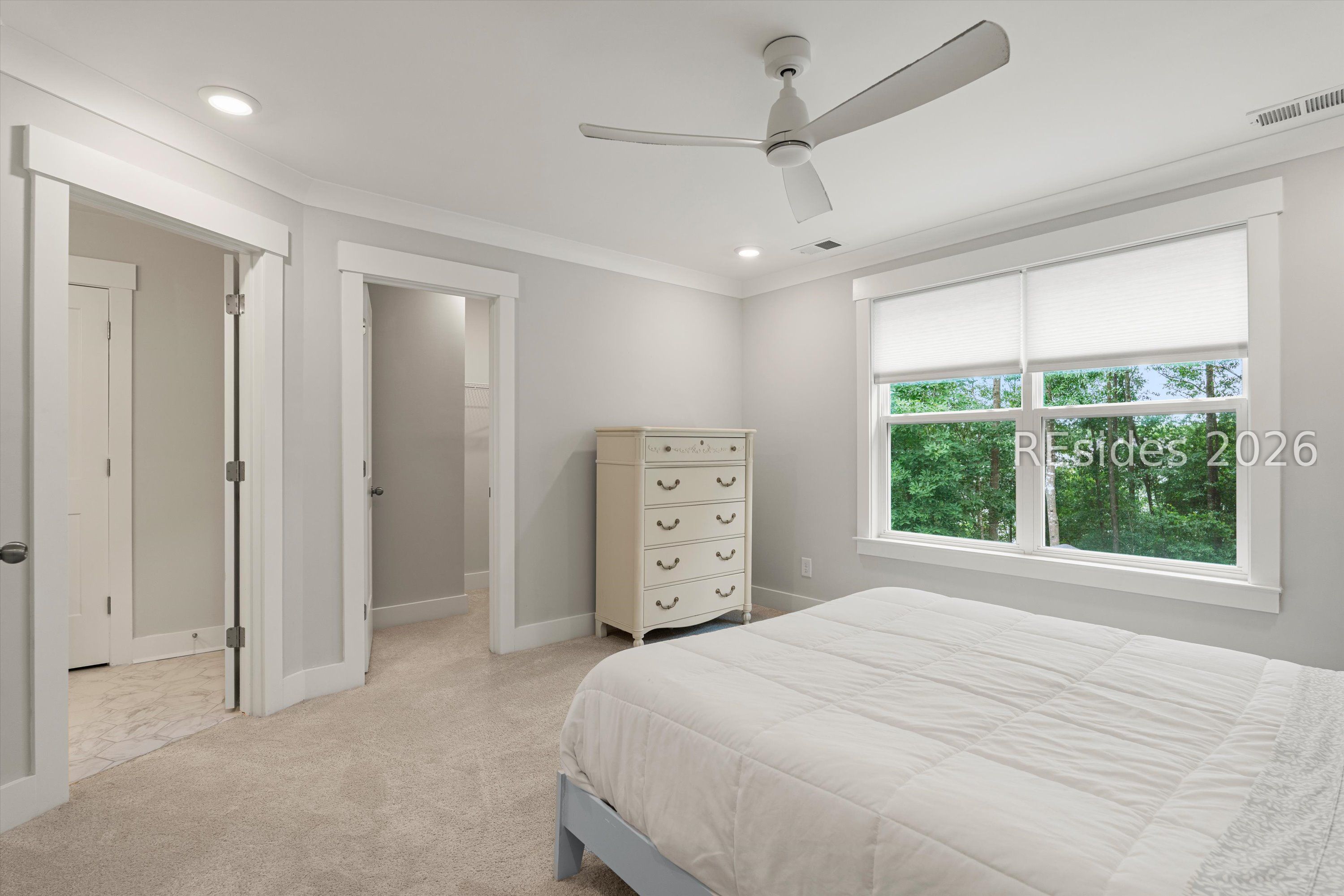 318 Forest Trace Bluffton, SC 29910 - Photo 30 of 59 Large Primary Bedroom with Scenic Wooded View