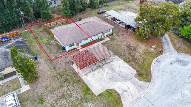 an aerial view of a house with outdoor space