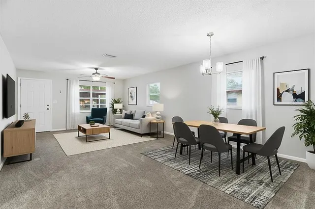 a view of a livingroom with furniture and window