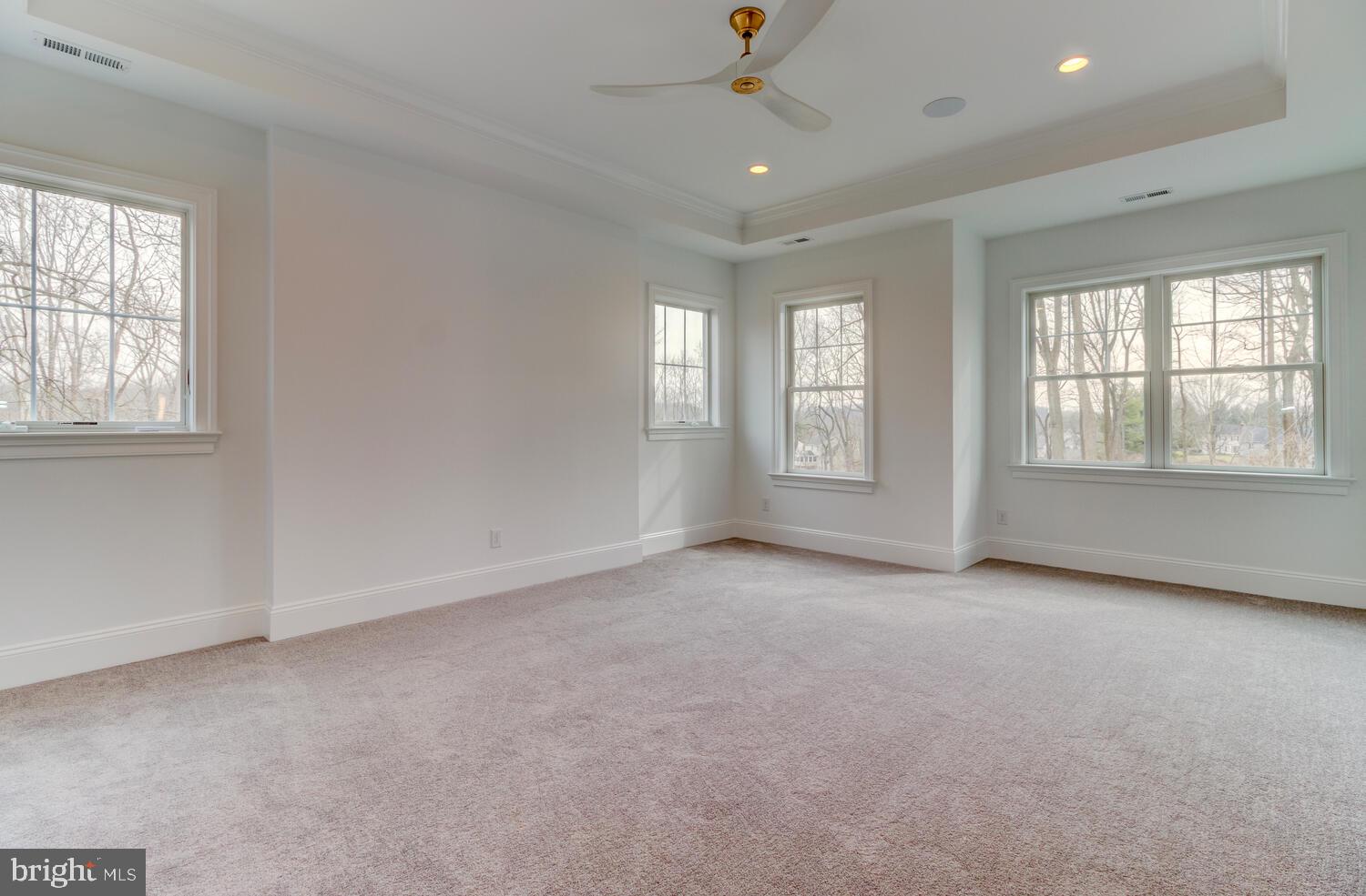 5 Rose Glenn Devon, PA 19333 - Photo 11 of 40 an empty room with chandelier fan and windows