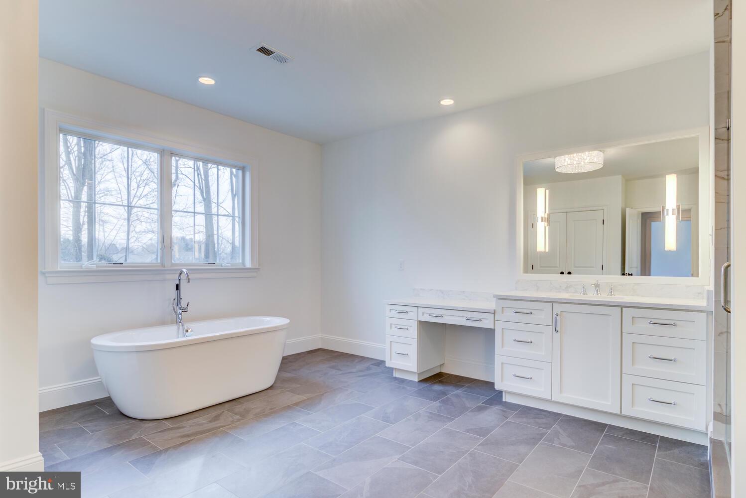 5 Rose Glenn Devon, PA 19333 - Photo 16 of 40 a spacious bathroom with a bathtub and 2 sink