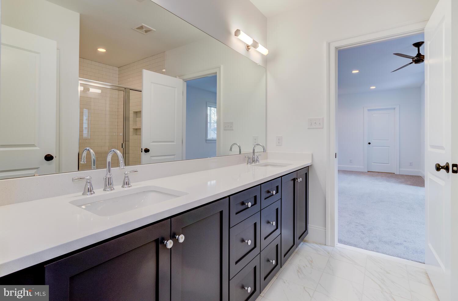 5 Rose Glenn Devon, PA 19333 - Photo 19 of 40 a bathroom with double vanity sinks and a mirror