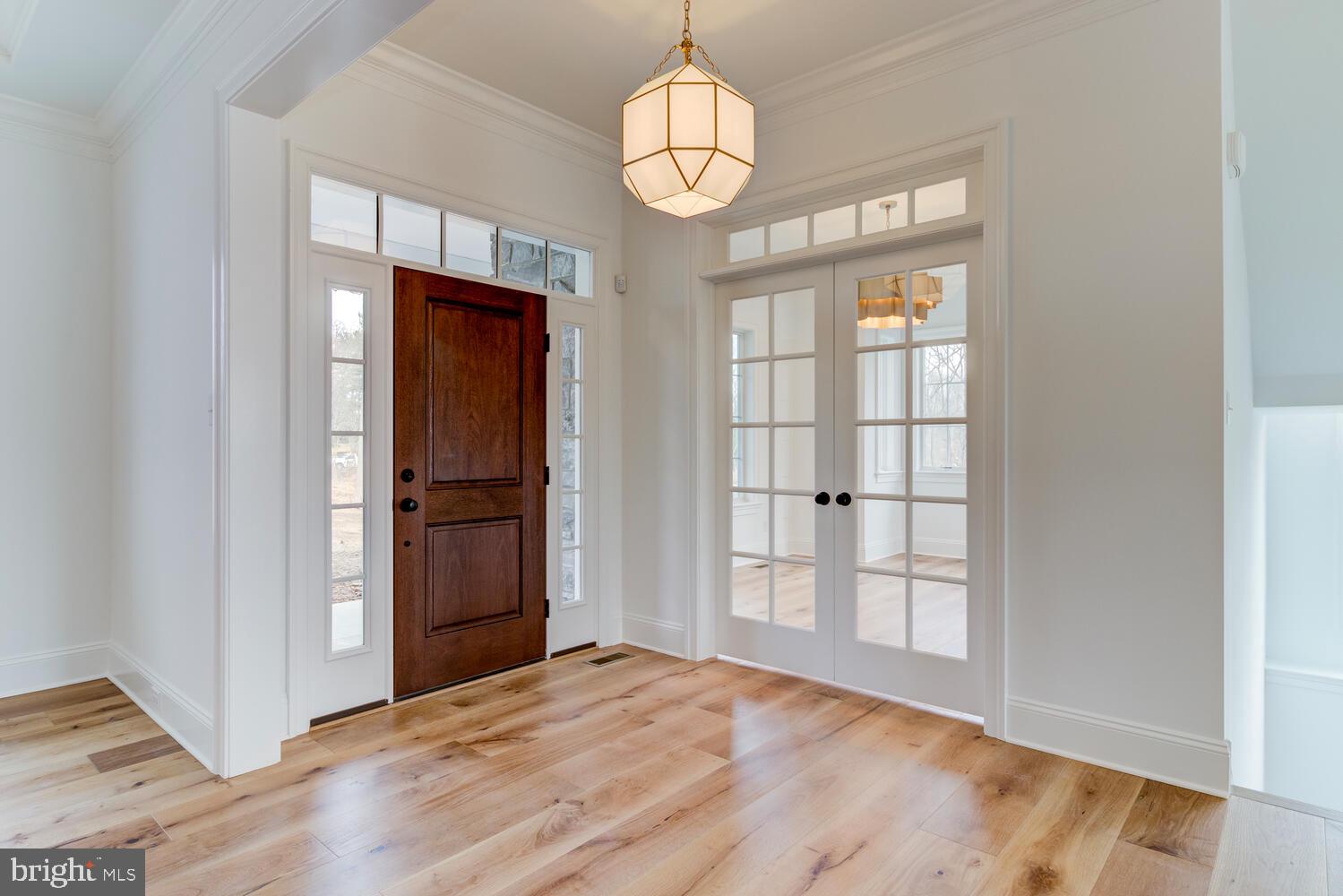 5 Rose Glenn Devon, PA 19333 - Photo 2 of 40 a view of an empty room with wooden floor and windows