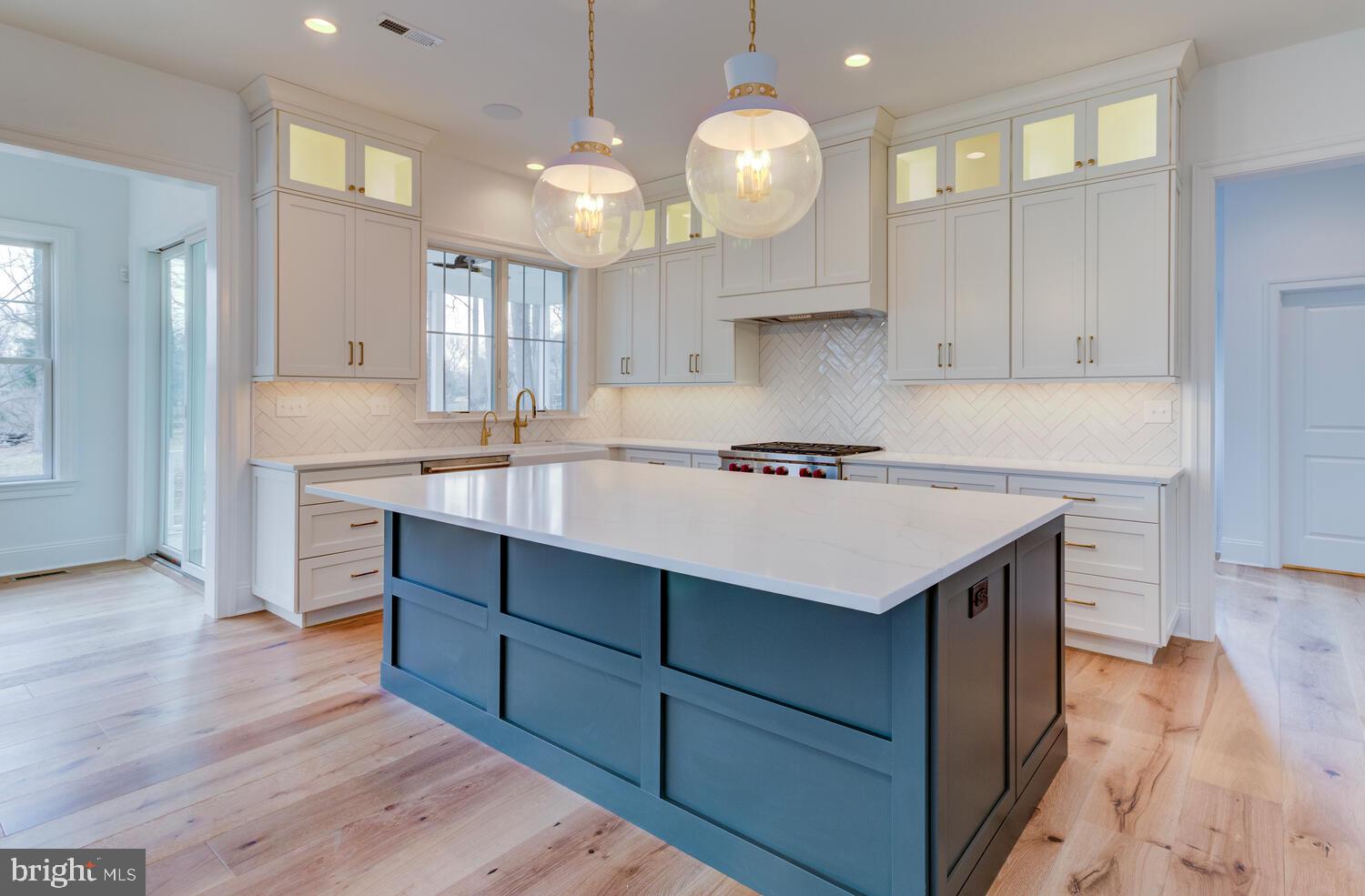 5 Rose Glenn Devon, PA 19333 - Photo 4 of 40 a kitchen with a sink cabinets and wooden floor