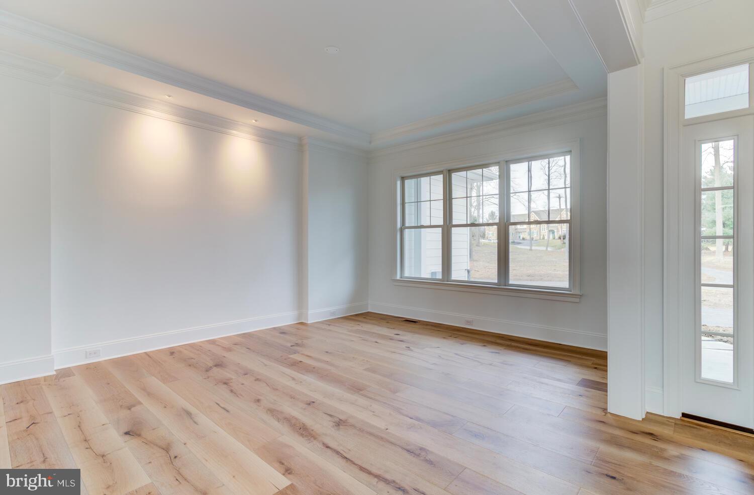 5 Rose Glenn Devon, PA 19333 - Photo 6 of 40 an empty room with wooden floor and windows