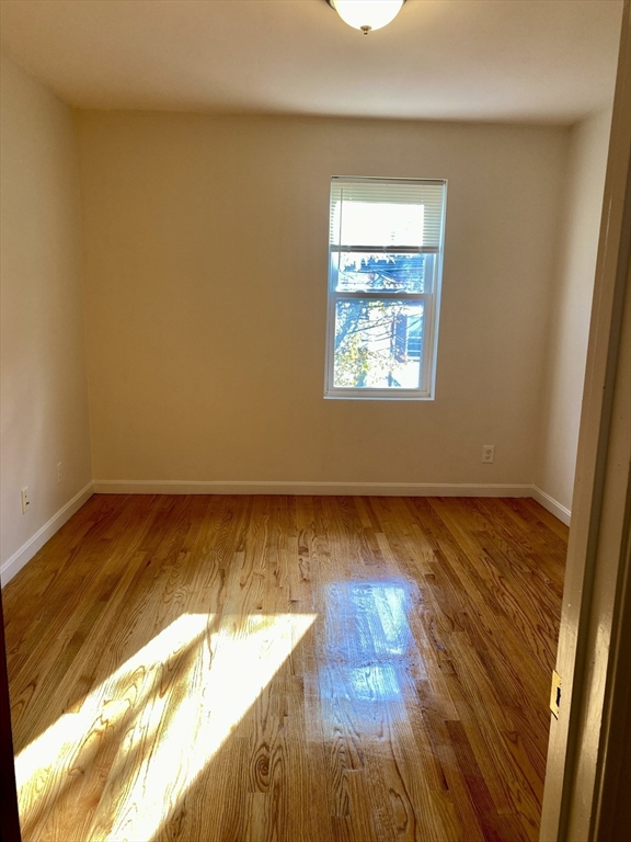 123 Thorndike Street, Unit 2L Cambridge, MA 02141 - Photo 14 of 19 a view of an ocean & mountain from a window
