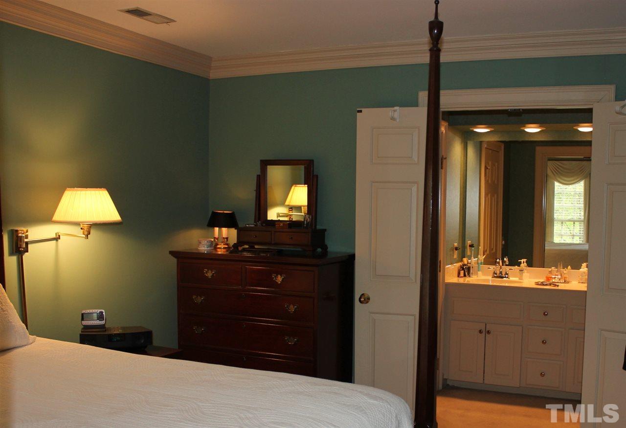 3308 Churchill Road Raleigh, NC 27607 - Photo 14 of 25 a bathroom with a sink vanity and a mirror