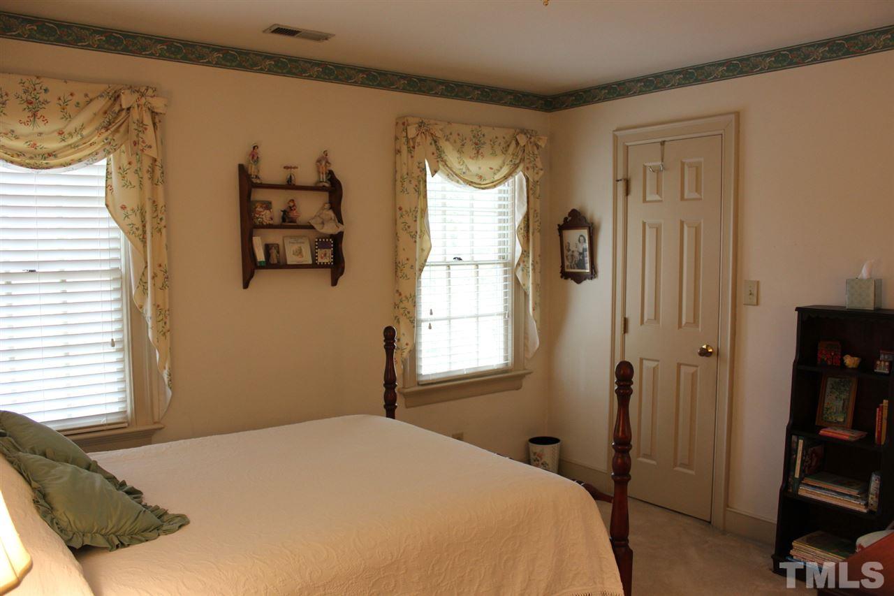 3308 Churchill Road Raleigh, NC 27607 - Photo 18 of 25 a bedroom with a bed and a window