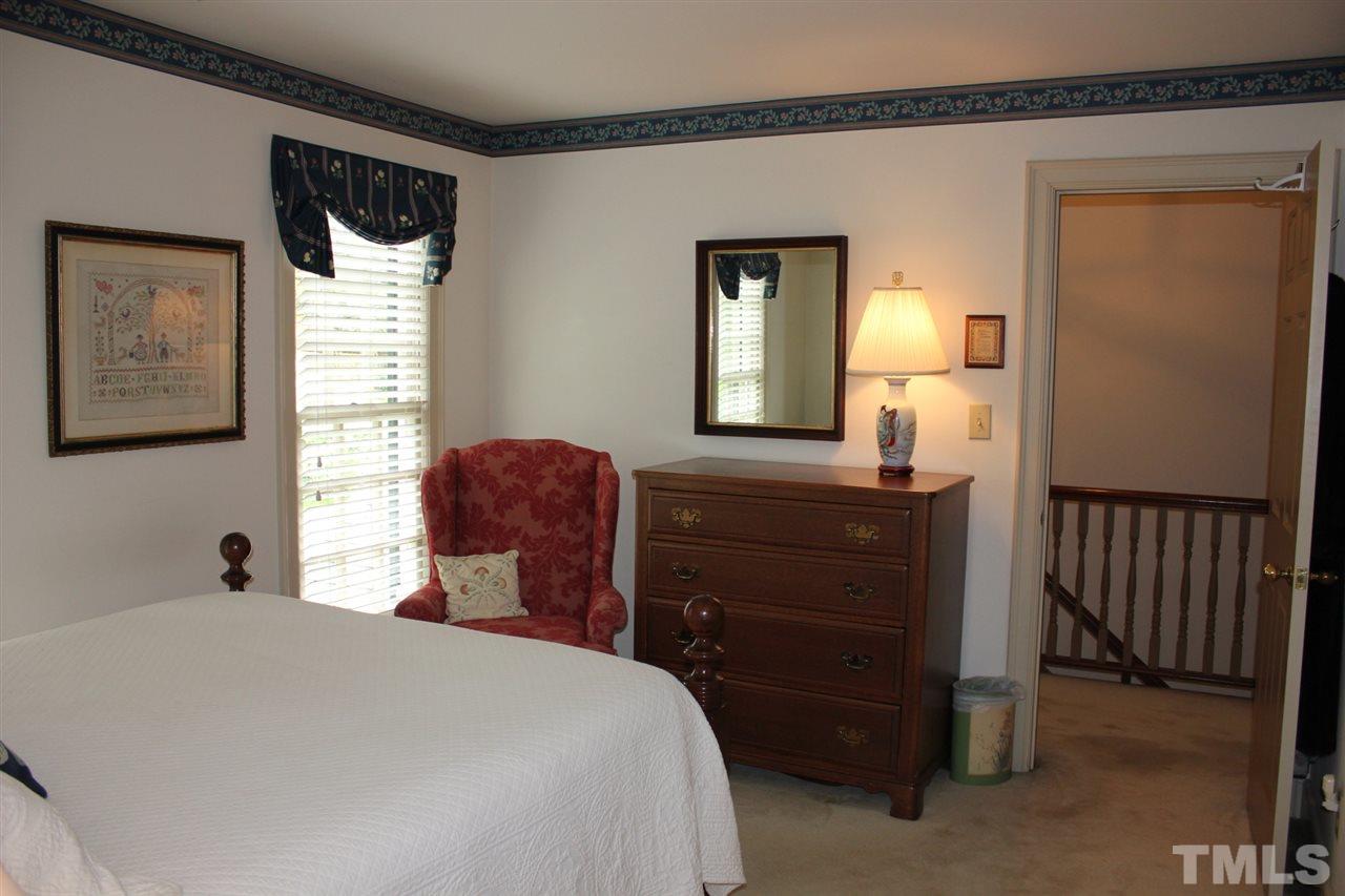3308 Churchill Road Raleigh, NC 27607 - Photo 20 of 25 a bedroom with a bed and a window