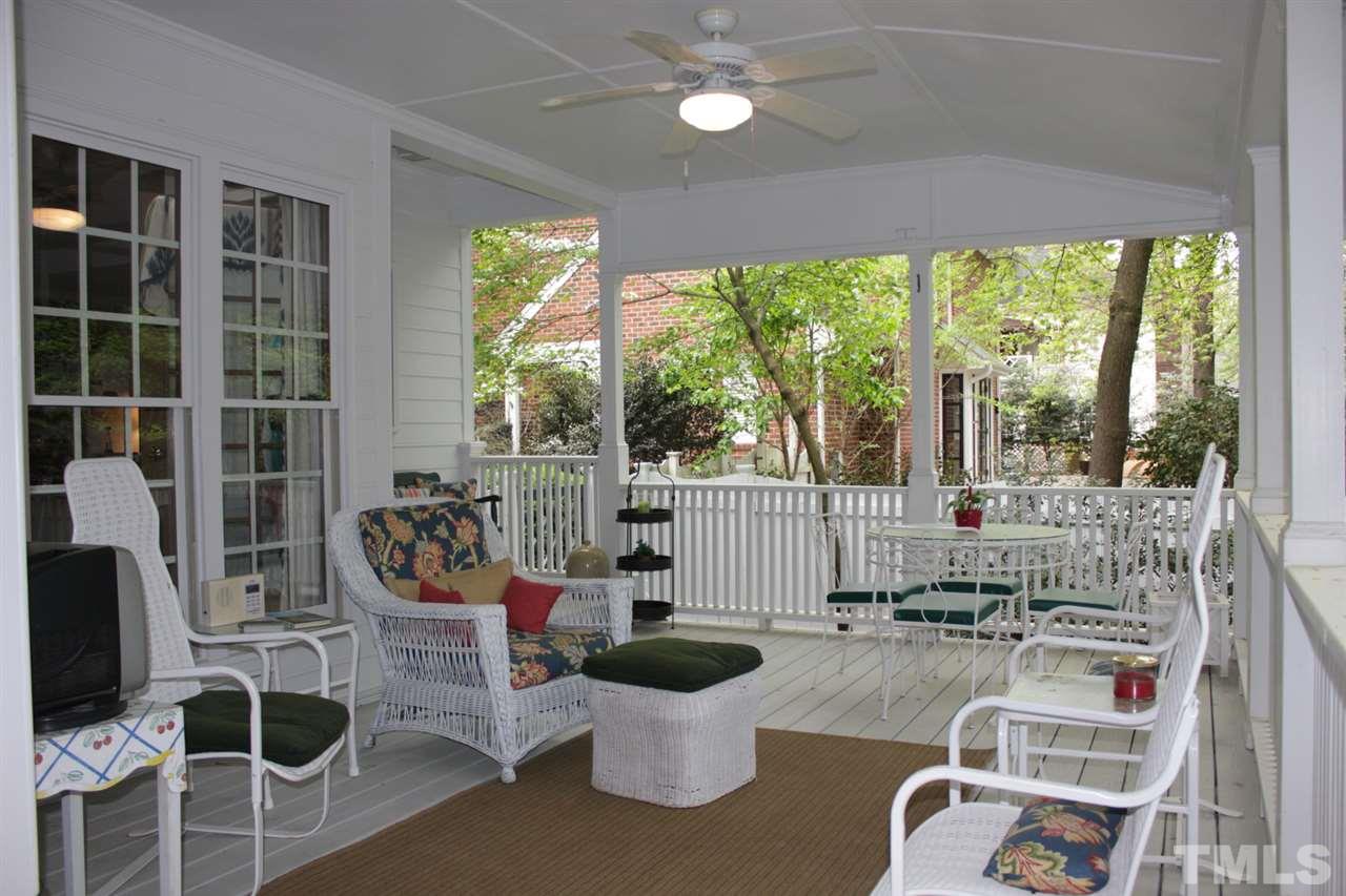 3308 Churchill Road Raleigh, NC 27607 - Photo 23 of 25 a living room with furniture and a floor to ceiling window