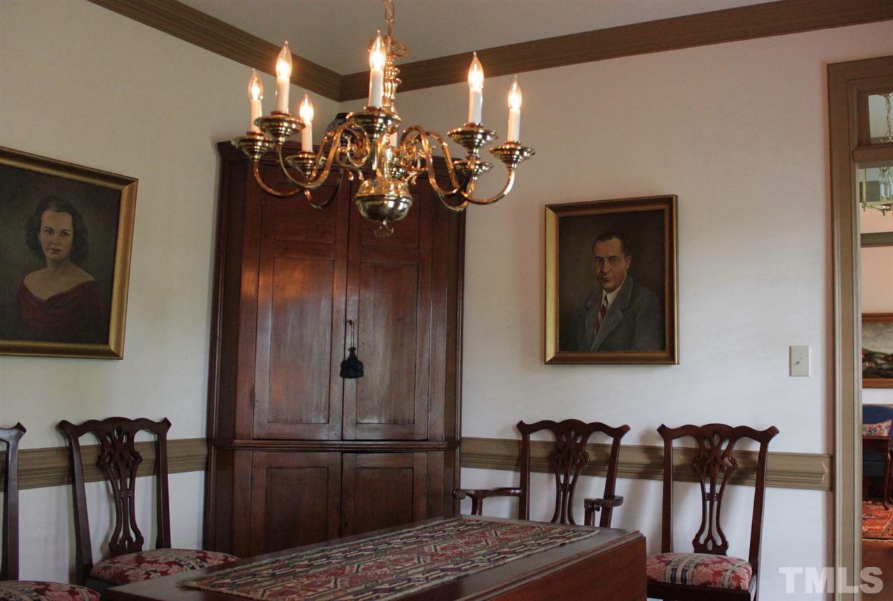 3308 Churchill Road Raleigh, NC 27607 - Photo 4 of 25 a view of a dining room with furniture and chandelier