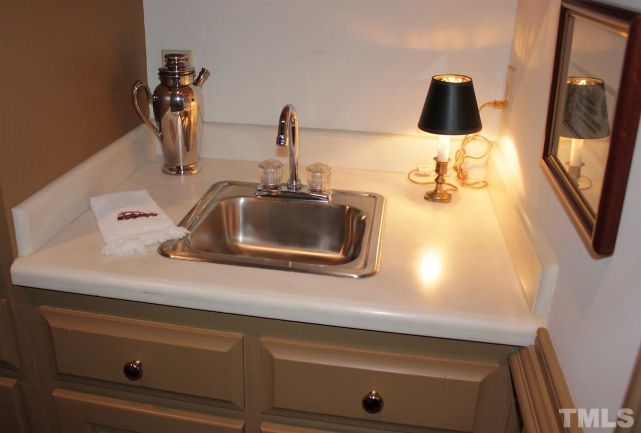 3308 Churchill Road Raleigh, NC 27607 - Photo 6 of 25 a bathroom with a sink and a mirror