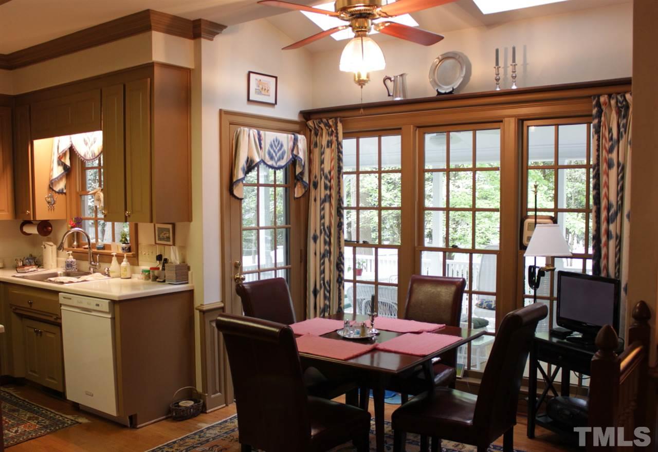 3308 Churchill Road Raleigh, NC 27607 - Photo 7 of 25 a view of a dining room with furniture window and outside view