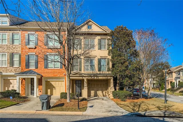 a front view of a building with a yard