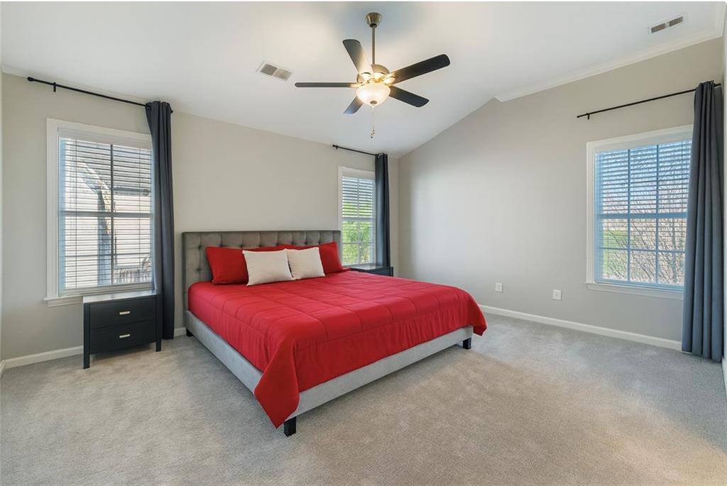 6414 Queens Court Trace, Unit 7 Mableton, GA 30126 - Photo 15 of 28 a spacious bedroom with a bed and window