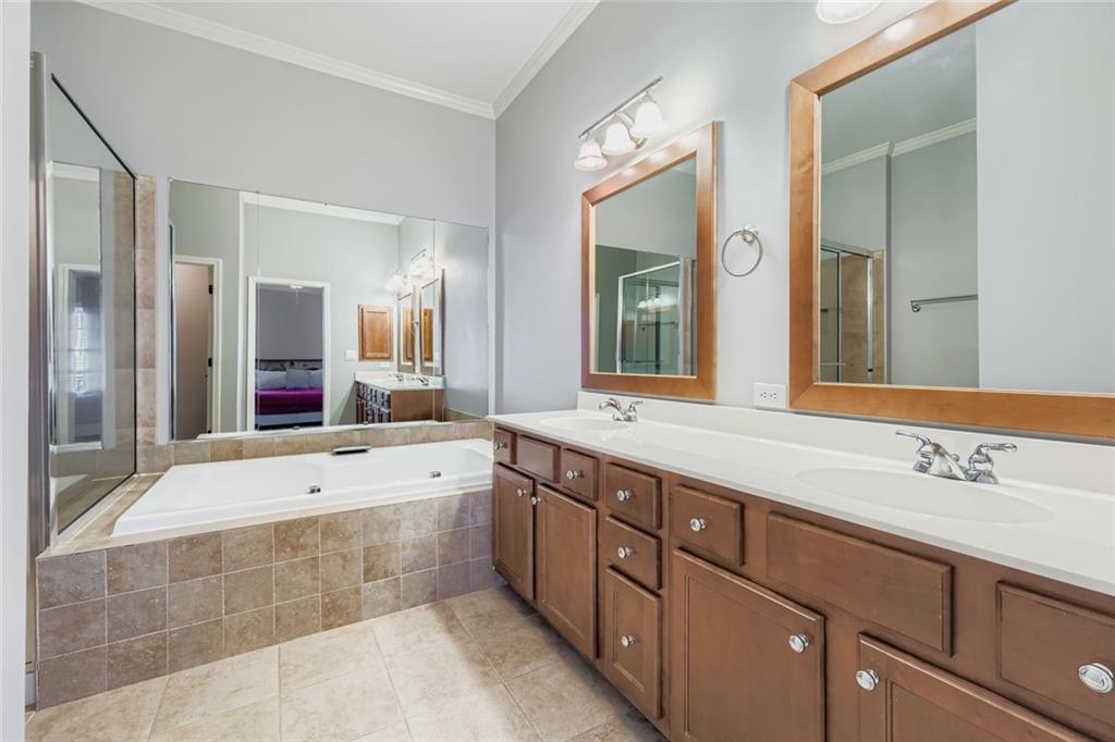 6414 Queens Court Trace, Unit 7 Mableton, GA 30126 - Photo 17 of 28 a spacious bathroom with a tub sink and mirror