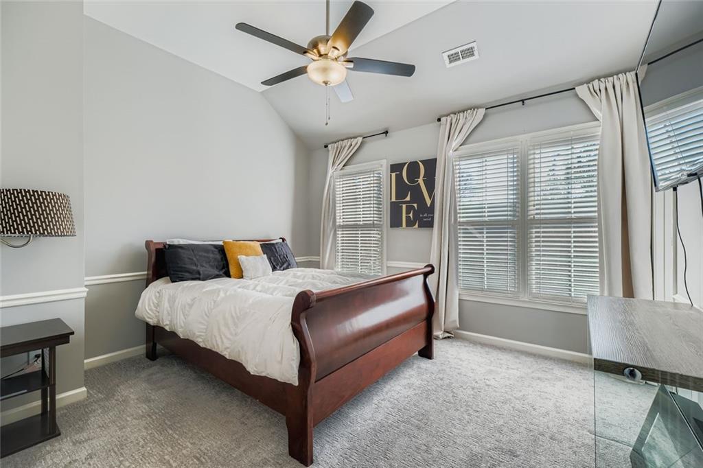 6414 Queens Court Trace, Unit 7 Mableton, GA 30126 - Photo 19 of 28 a bedroom with a bed dresser and a window