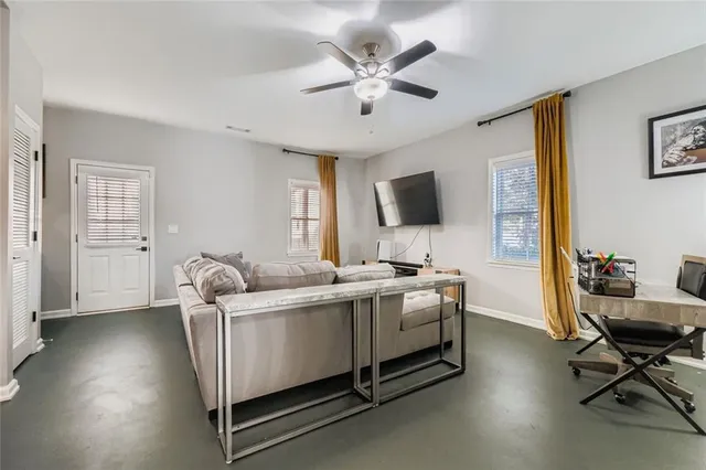 a living room with a couch and a flat screen tv
