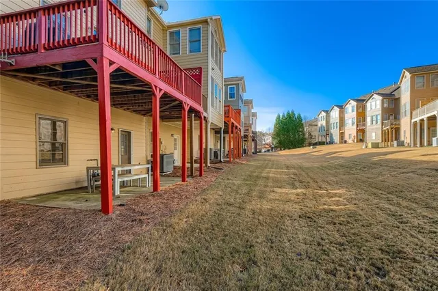 a view of a house with wooden fence