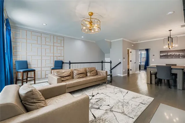 a living room with furniture and a rug