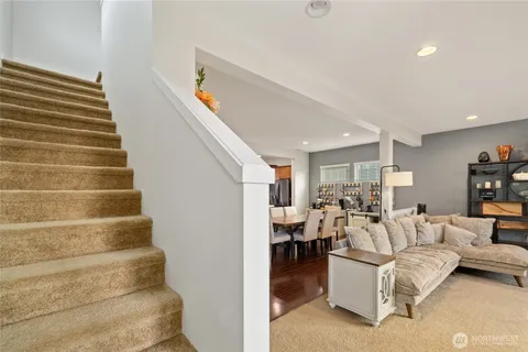 a bedroom with a bed a couch and dresser