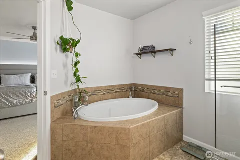 a bathroom with a glass shower door